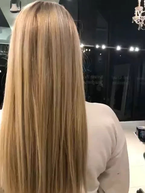 Brazilian Blowout smoothing result on long blonde hair, glossy and straight, back view by Richie at Damron & Company Salon in Austin
