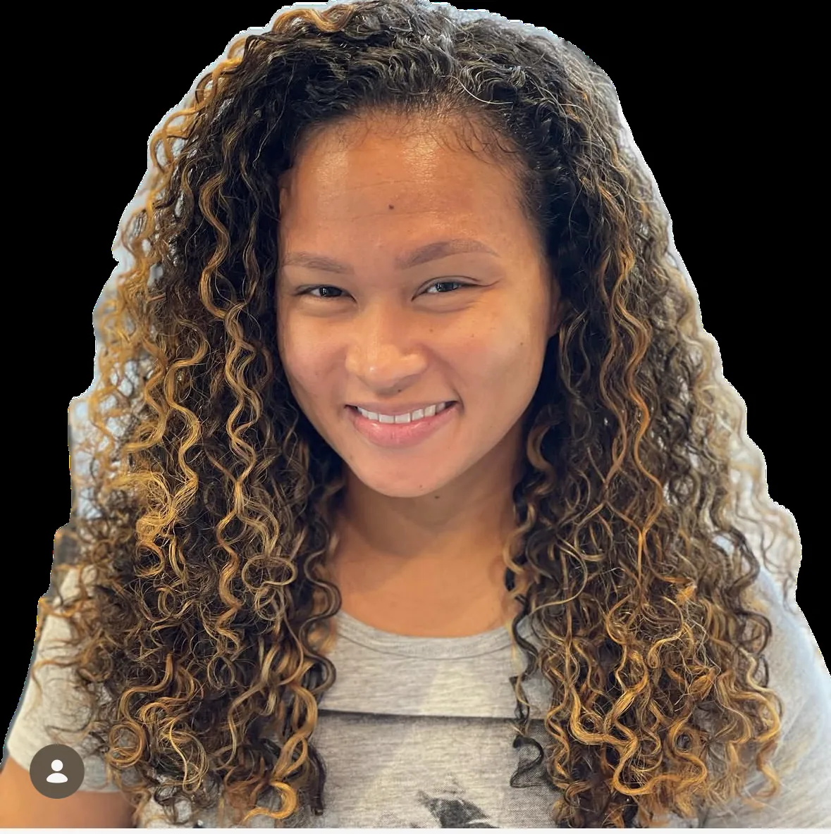Deva cut with balayage on long dark tight curls with golden highlights by Richie at Damron & Company Salon in Austin